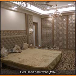 Ethnique master bedroom bed head Jaali & Wardrobe Jaali made from a combination material (laminate pasted over MDF).jpg